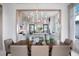 Elegant dining room features a large wooden table and a modern chandelier at 4007 Grande Brick Loop # 13, Orlando, FL 32837