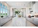 Modern kitchen featuring a large marble island and high-end appliances at 4139 Grande Brick Loop # 15, Orlando, FL 32837