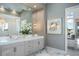 Elegant bathroom with double vanities, marble floors, and a large mirror at 4139 Grande Brick Loop # 15, Orlando, FL 32837