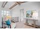 Elegant hallway showcasing hardwood floors, a metal railing, and coastal artwork at 4139 Grande Brick Loop # 15, Orlando, FL 32837