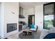 Outdoor kitchen features a built-in grill, fireplace, and seating area at 4168 Grande Brick Loop # 26, Orlando, FL 32837