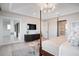 Main bedroom with a large bed, sitting area, and views of the hallway at 4168 Grande Brick Loop # 26, Orlando, FL 32837