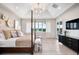 Main bedroom with a large bed, sitting area, and golf course views at 4168 Grande Brick Loop # 26, Orlando, FL 32837