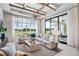 Bright living room boasts a comfortable sectional sofa, large windows, and access to the outdoors at 4168 Grande Brick Loop # 26, Orlando, FL 32837
