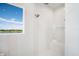 Bright shower with a built-in seat and window view at 4163 Grande Brick Loop # 19, Orlando, FL 32837