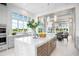 Modern kitchen with a large island and high-end appliances, overlooking Gathering room at 4163 Grande Brick Loop # 19, Orlando, FL 32837