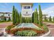 Elegant community entrance with fountain and landscaping at 4163 Grande Brick Loop # 19, Orlando, FL 32837