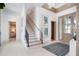 Bright and airy entryway with staircase, modern art, and tile flooring at 4163 Grande Brick Loop # 19, Orlando, FL 32837