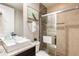 Clean bathroom with single vanity, walk-in shower, and neutral tones at 7538 Sunville Ave, Kissimmee, FL 34747