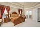Bright Primary bedroom with king-size bed and French doors at 6443 Cartmel Ln, Windermere, FL 34786