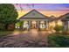 Elegant home exterior with brick driveway and lush landscaping at 6443 Cartmel Ln, Windermere, FL 34786