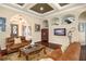 Spacious living room featuring hardwood floors, comfortable seating, and an inviting atmosphere at 6443 Cartmel Ln, Windermere, FL 34786