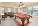 Game room with pool table and comfortable seating at 6443 Cartmel Ln, Windermere, FL 34786