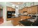 Well-equipped kitchen with an island, granite countertops, and ample cabinetry at 6443 Cartmel Ln, Windermere, FL 34786