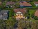 Aerial view of a luxurious home with a large yard at 6443 Cartmel Ln, Windermere, FL 34786