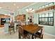 Bright kitchen nook with a wood table and chairs, offering a view of the backyard at 6443 Cartmel Ln, Windermere, FL 34786