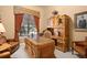 Inviting home office with built-in cabinetry and comfortable seating at 6443 Cartmel Ln, Windermere, FL 34786
