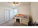 Bedroom with built-in bunk bed, window, and ceiling fan at 728 Costa Ln, Debary, FL 32713