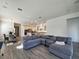 Spacious living room with L-shaped sofa and open layout at 728 Costa Ln, Debary, FL 32713