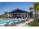 Resort-style pool with lounge chairs and a shaded area at 728 Costa Ln, Debary, FL 32713