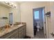 Bathroom with granite countertop vanity and toilet in separate room at 728 Costa Ln, Debary, FL 32713