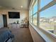 Bright bedroom with large windows, dresser, and plant stand at 728 Costa Ln, Debary, FL 32713