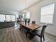 Bright dining area with a rustic wood table and gray chairs at 728 Costa Ln, Debary, FL 32713