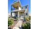 Two-story house with balcony, stone accents, and landscaped yard at 728 Costa Ln, Debary, FL 32713