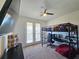 Bedroom with built-in desk, lofted bed, and balcony access at 728 Costa Ln, Debary, FL 32713