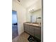 Double vanity bathroom with granite countertops and grey cabinets at 728 Costa Ln, Debary, FL 32713