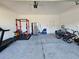 Garage with gym equipment and bikes at 728 Costa Ln, Debary, FL 32713