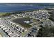 Aerial view of community, lake, and homes at 728 Costa Ln, Debary, FL 32713