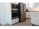 Stainless steel appliances are built into white kitchen cabinetry at 728 Costa Ln, Debary, FL 32713