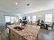 Open kitchen boasts granite counters, stainless steel appliances, and an island at 728 Costa Ln, Debary, FL 32713