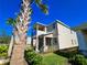 Two-story house with balcony and palm trees in front at 728 Costa Ln, Debary, FL 32713