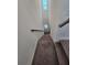 Carpeted staircase with a modern metal railing at 728 Costa Ln, Debary, FL 32713