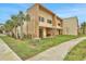 Modern two-story townhome with private patio and lush landscaping at 3062 Rockefeller Way, Kissimmee, FL 34747