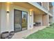 Private patio with sliding glass doors, outdoor seating, and modern lighting at 3062 Rockefeller Way, Kissimmee, FL 34747