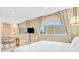 Main bedroom with large windows and seating area at 3062 Rockefeller Way, Kissimmee, FL 34747