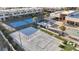 Aerial view showing tennis and volleyball courts, pool, and clubhouse at 3062 Rockefeller Way, Kissimmee, FL 34747