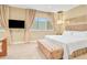 Main bedroom with king-size bed and sitting area at 3062 Rockefeller Way, Kissimmee, FL 34747