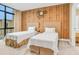 Twin bedroom with wood-paneled accent wall at 3062 Rockefeller Way, Kissimmee, FL 34747