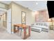 Bright office space featuring a wooden desk and comfortable couch at 3062 Rockefeller Way, Kissimmee, FL 34747