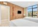 Bedroom with wood-paneled wall and twin beds at 3062 Rockefeller Way, Kissimmee, FL 34747