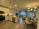 Open floor plan with modern kitchen and living area at 14563 Orchid Island Dr, Orlando, FL 32827