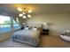 Spacious main bedroom with large windows and plush bed at 14563 Orchid Island Dr, Orlando, FL 32827