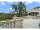 Elegant patio with stone balustrades and scenic backyard views at 5507 Worsham Court, Windermere, FL 34786