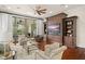 Spacious Gathering room with built-in shelving and hardwood floors at 5507 Worsham Court, Windermere, FL 34786
