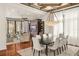 Bright dining room features a large table, hardwood floors, and adjacent living area at 5507 Worsham Court, Windermere, FL 34786