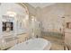 Primary bathroom with soaking tub and walk-in shower at 5507 Worsham Court, Windermere, FL 34786